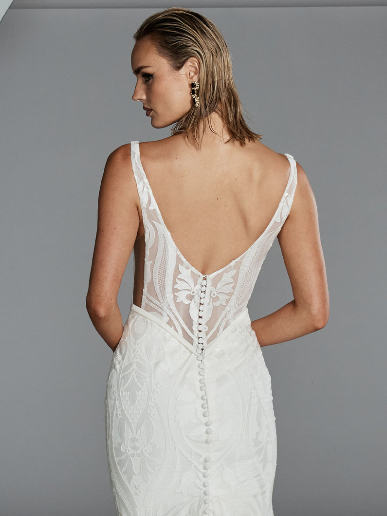 Back view of Holden wedding gown with illusion V-back and Basque waistline