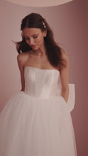 Load and play video in Gallery viewer, Vidoe of Nadia by Ariamo L427 - Mikado and tulle wedding dress  with detachable oversized bow and sweetheart neckline
