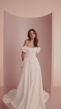 Load and play video in Gallery viewer, Primrose by Ariamo L402 mat satin A-line wedding dress video with strapless emi-sweetheart neckline and detachable floral straps
